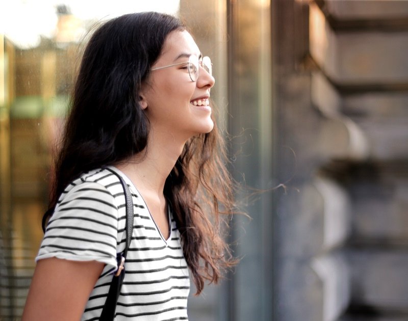 girl in striped shirt and glasses