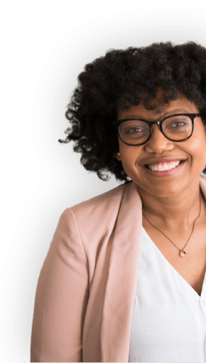 woman smiling in pink blazer and glasses