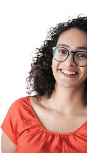 girl in orange shirt and glasses smiling